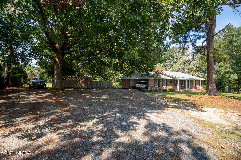 156 Walton Road Fort Valley, GA 31030 - Photo 39 of 61 a view of a house with yard and sitting area