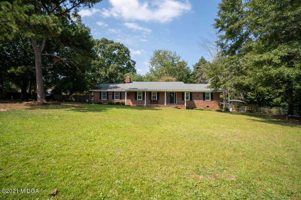 156 Walton Road Fort Valley, GA 31030 - Photo 41 of 61 a house with swimming pool in front of it