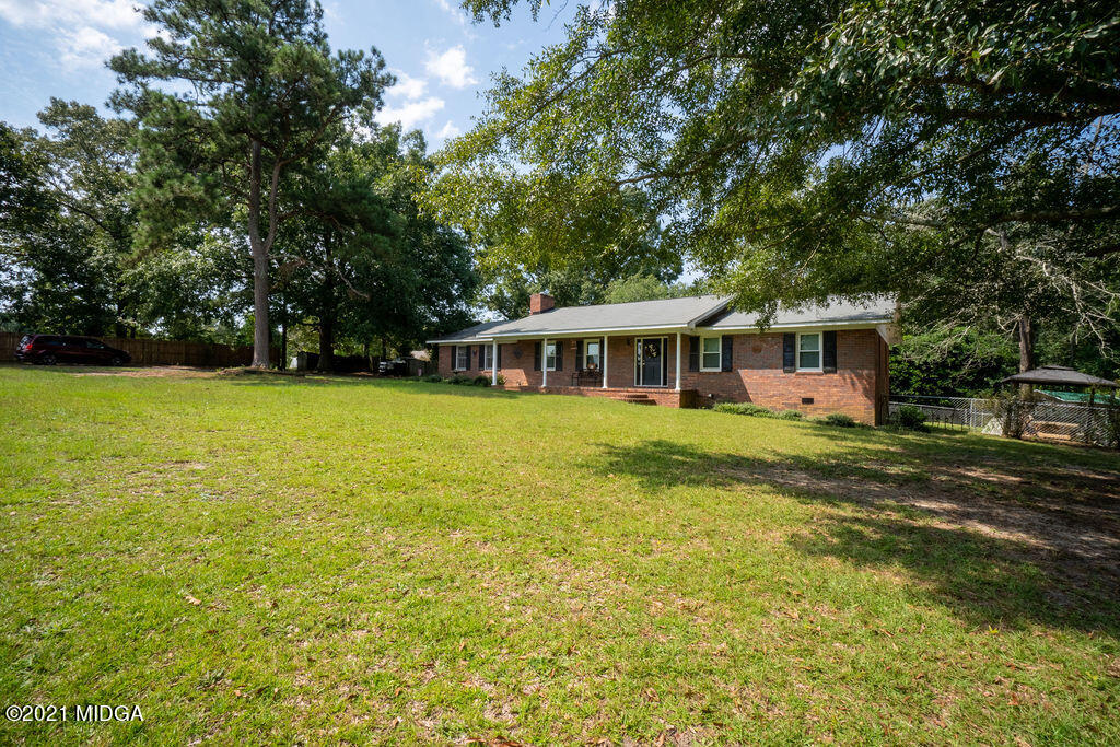 156 Walton Road Fort Valley, GA 31030 - Photo 42 of 61 a view of a house with a backyard