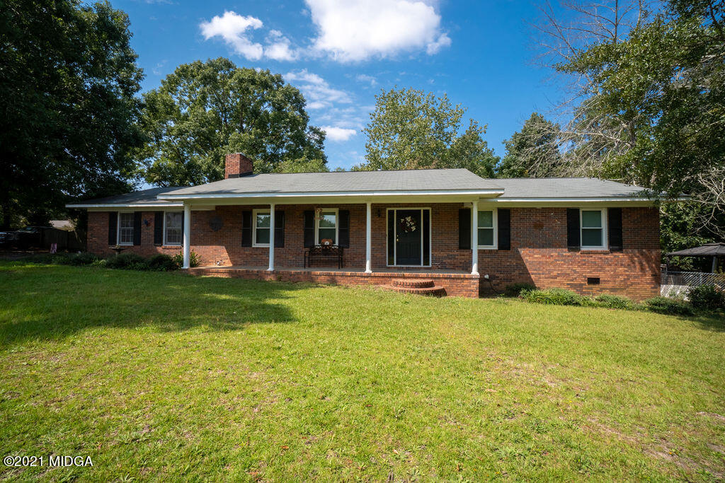 156 Walton Road Fort Valley, GA 31030 - Photo 45 of 61 a view of a house with a yard patio and swimming pool