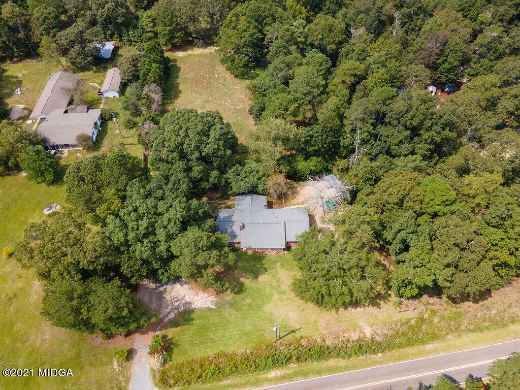156 Walton Road Fort Valley, GA 31030 - Photo 56 of 61 an aerial view of a house with a yard and lake view