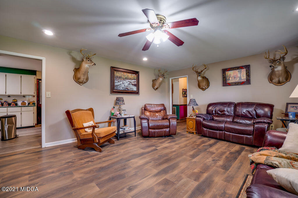 156 Walton Road Fort Valley, GA 31030 - Photo 8 of 61 a living room with furniture and a chandelier