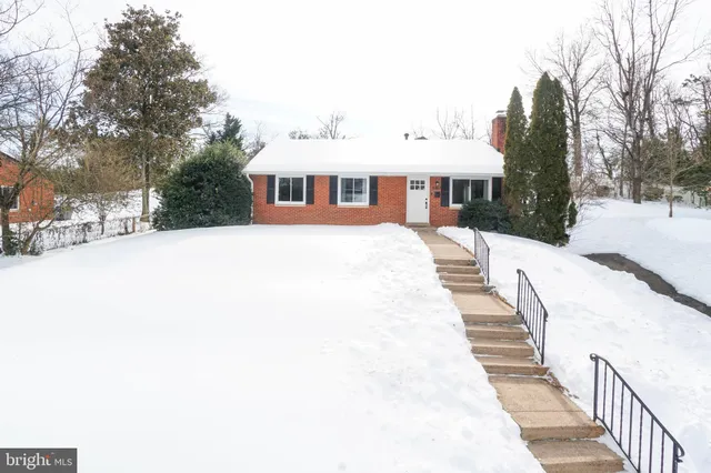 a view of a white house with a yard