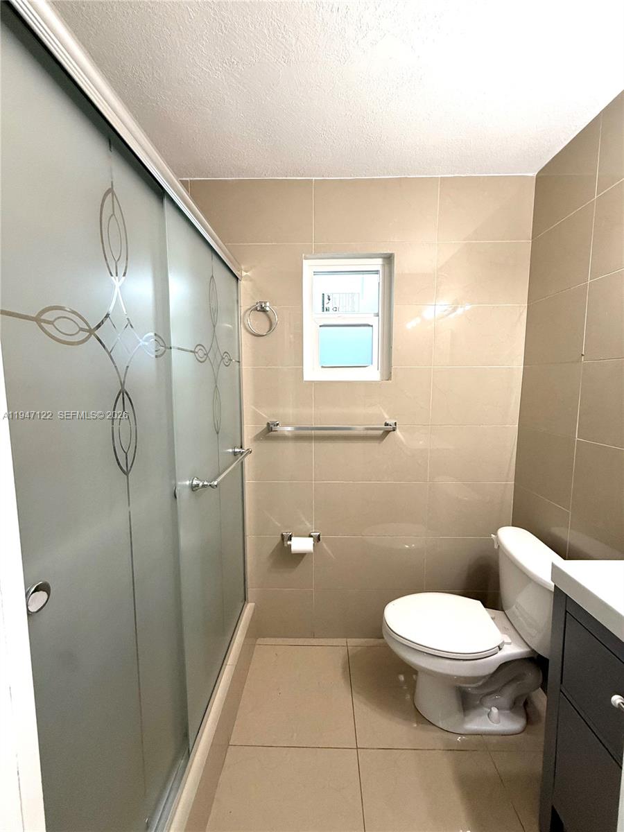 5715 Arthur Street Hollywood, FL 33021 - Photo 11 of 15 a bathroom with a toilet and a shower