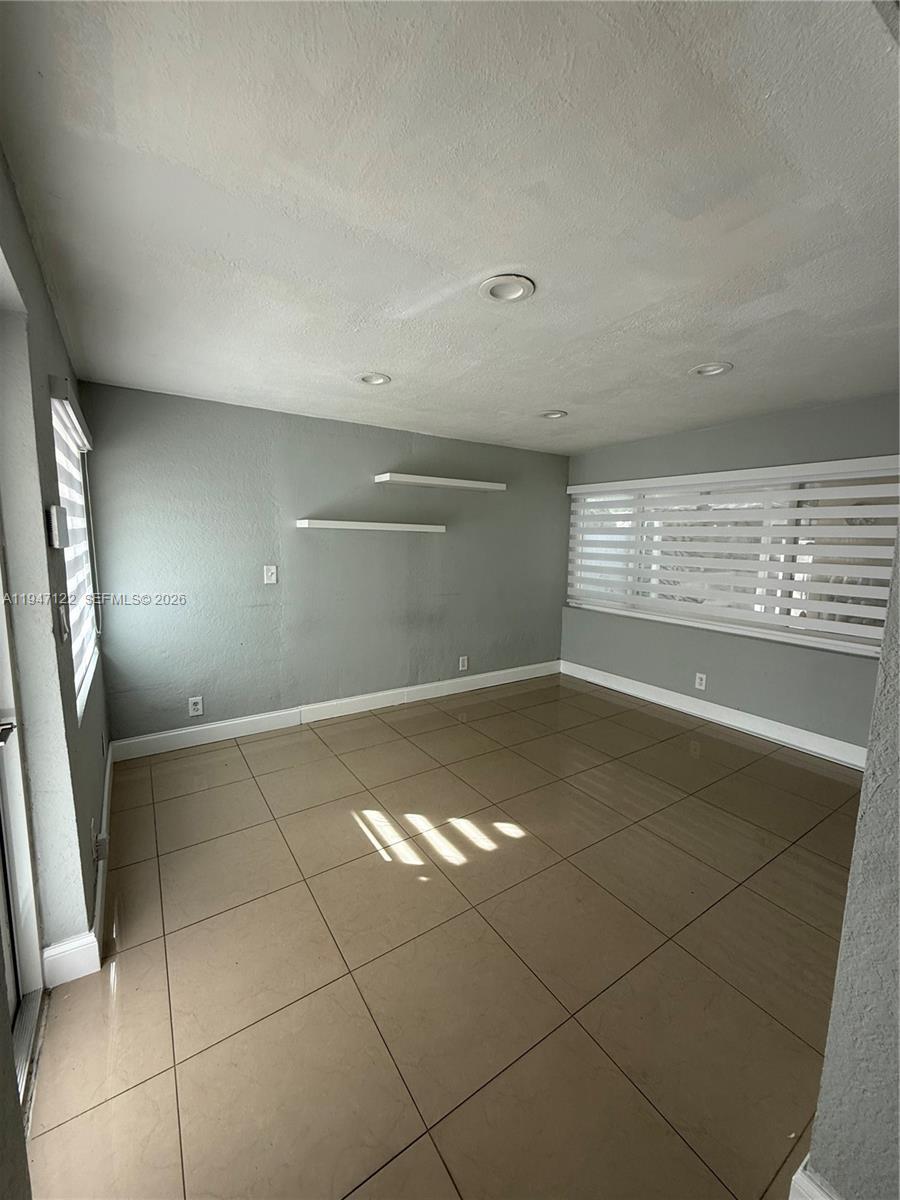 5715 Arthur Street Hollywood, FL 33021 - Photo 12 of 15 a view of an empty room with a window