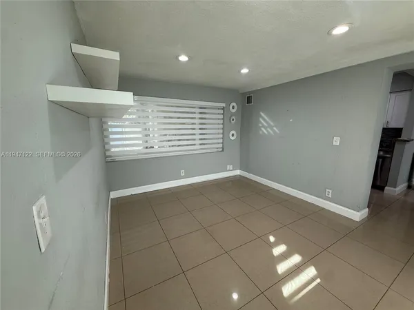 a view of a livingroom with a staircase