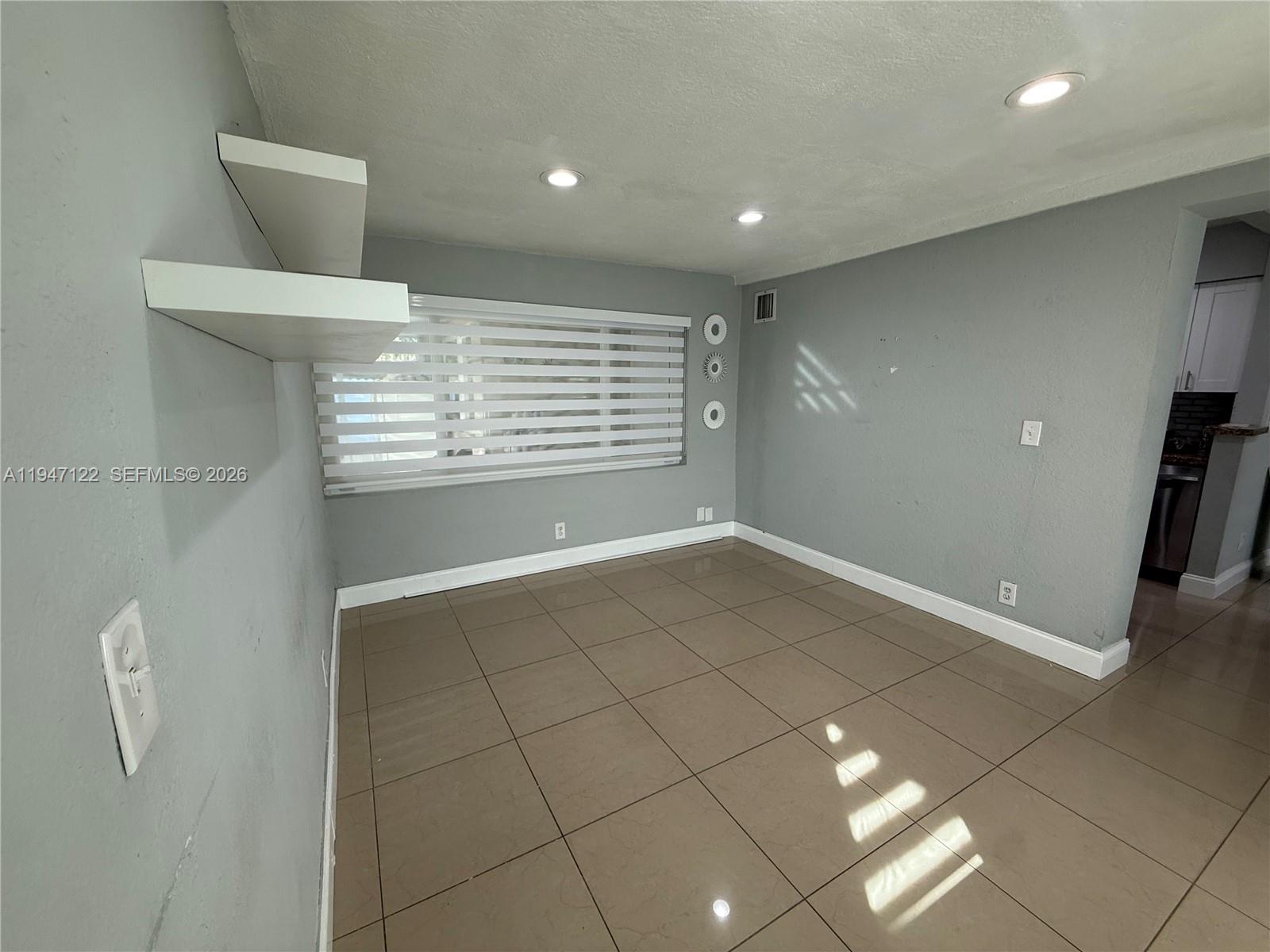 5715 Arthur Street Hollywood, FL 33021 - Photo 3 of 15 a view of a livingroom with a staircase