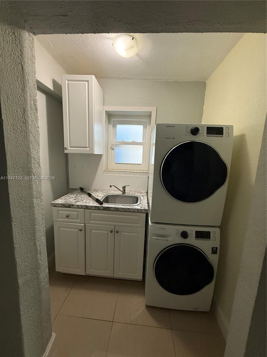 5715 Arthur Street Hollywood, FL 33021 - Photo 10 of 15 a utility room with sink dryer and washer