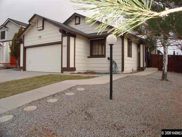 5877 Bankside Way Reno, NV 89523 - Photo 1 of 9 a front view of a house with garden