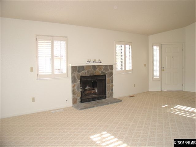 5877 Bankside Way Reno, NV 89523 - Photo 2 of 9 a view of empty room with a fireplace