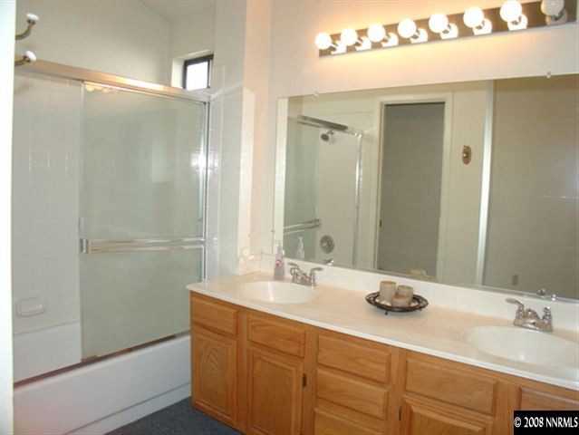 5877 Bankside Way Reno, NV 89523 - Photo 6 of 9 a bathroom with a sink and a mirror