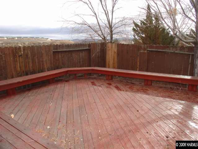 5877 Bankside Way Reno, NV 89523 - Photo 7 of 9 a view of a room with wooden floor and a large tree