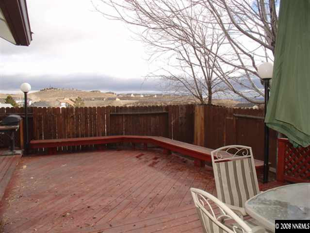 5877 Bankside Way Reno, NV 89523 - Photo 8 of 9 a view of a backyard with furniture and a swing