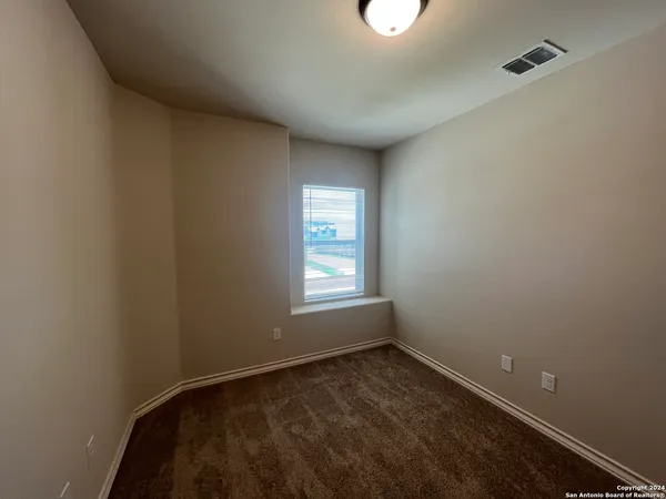 a view of a room that has a window in it