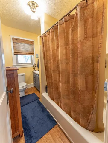 a view of a bathroom with a shower and a tub