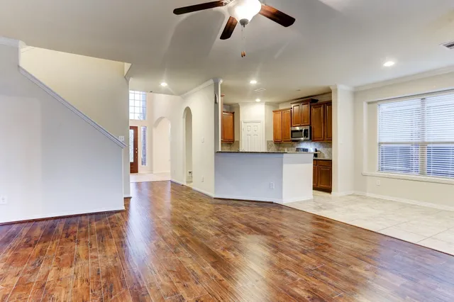 a view of a kitchen with a stove cabinets and wooden floor