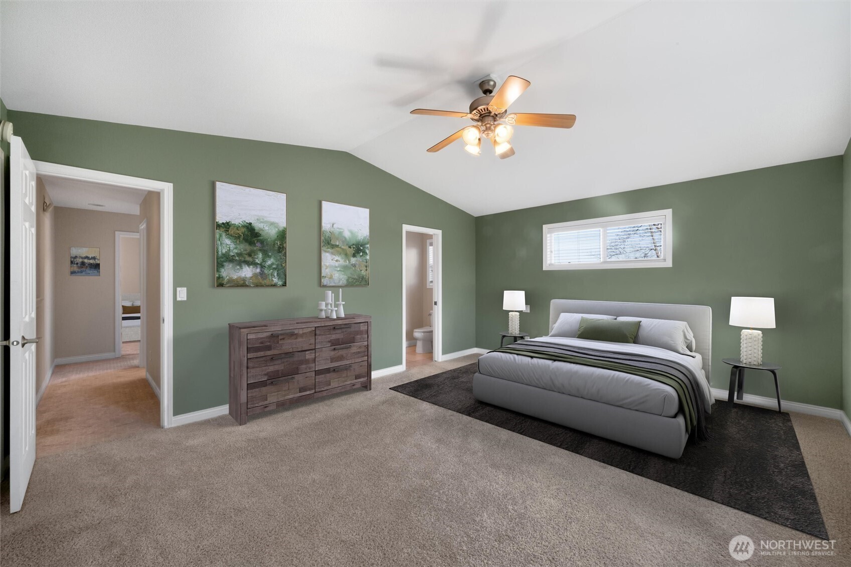 8148 Quinault Road Blaine, WA 98230 - Photo 16 of 40 a spacious bedroom with a bed and a chandelier