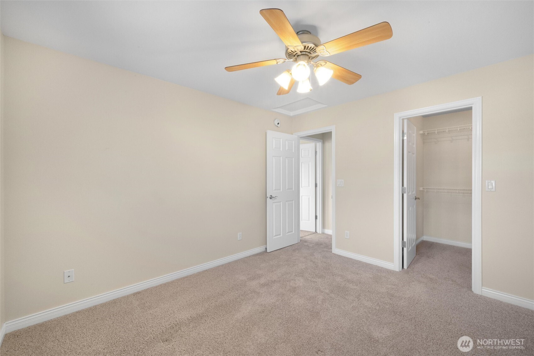 8148 Quinault Road Blaine, WA 98230 - Photo 20 of 40 an empty room with a chandelier fan