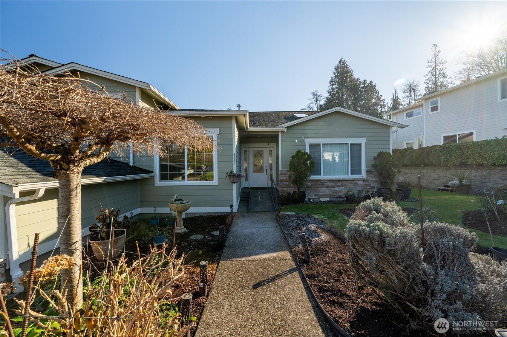 8148 Quinault Road Blaine, WA 98230 - Photo 3 of 40 a front view of a house with garden