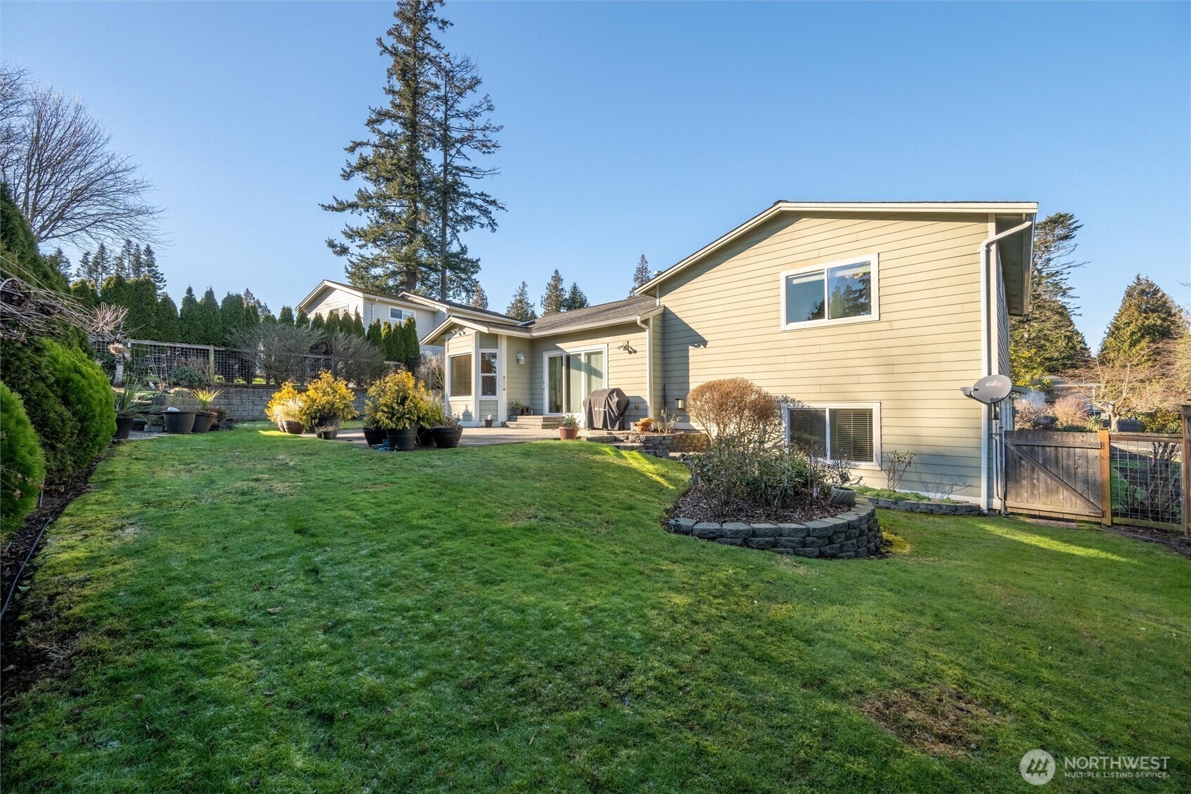 8148 Quinault Road Blaine, WA 98230 - Photo 33 of 40 a front view of a house with backyard and garden