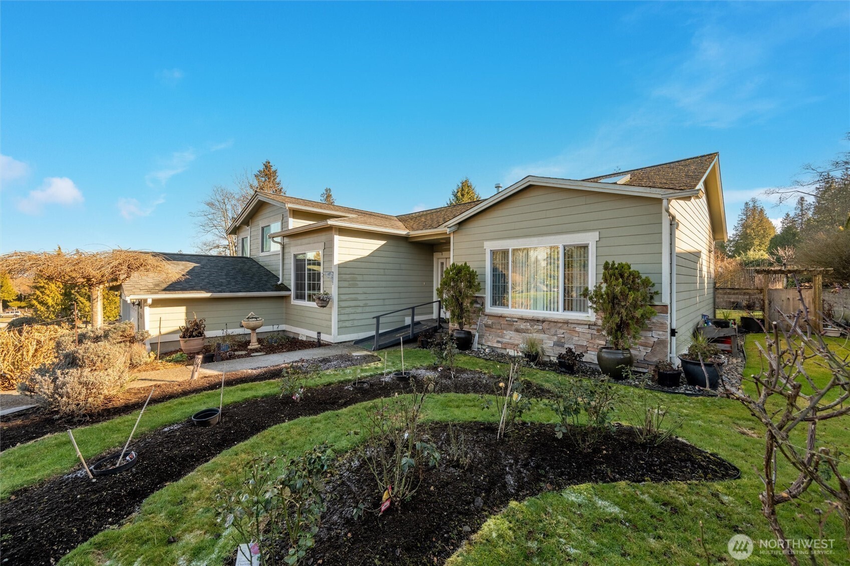 8148 Quinault Road Blaine, WA 98230 - Photo 34 of 40 a front view of a house with a yard