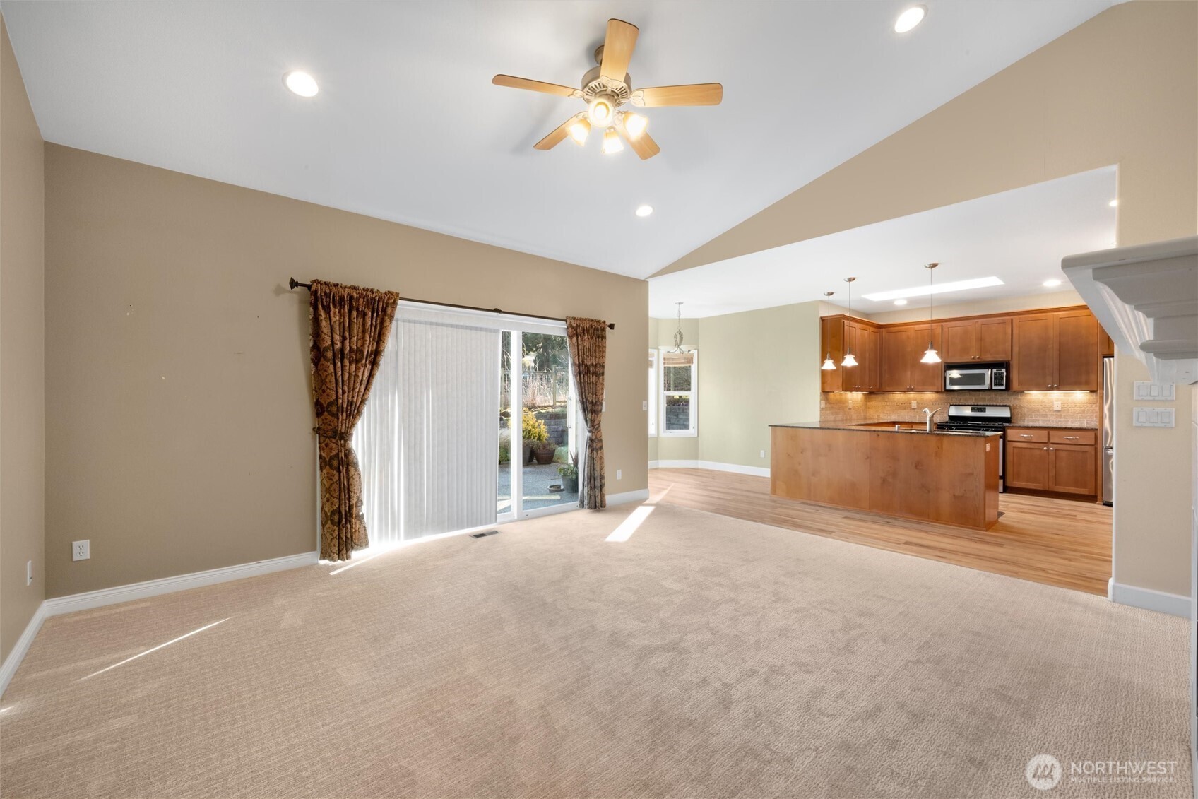 8148 Quinault Road Blaine, WA 98230 - Photo 6 of 40 a view of a kitchen with a sink and a refrigerator
