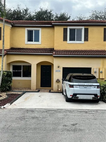 a car parked in front of a building