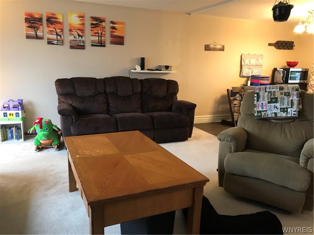 33 Anthony Drive Lancaster, NY 14043 - Photo 5 of 22 Living room flows into the dining room
