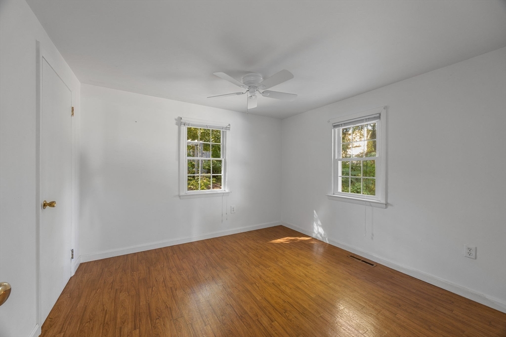 12 Spoonbill Road Dennis, MA 02670 - Photo 18 of 26 an empty room with a window and a ceiling fan