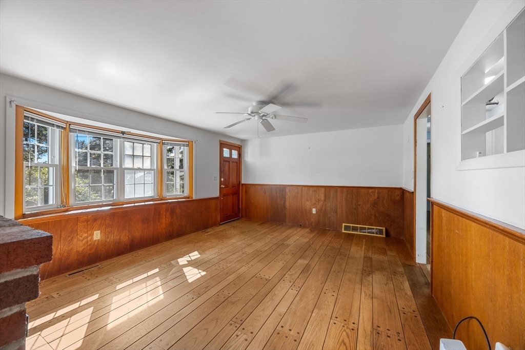 12 Spoonbill Road Dennis, MA 02670 - Photo 6 of 26 a view of empty room with wooden floor and fan