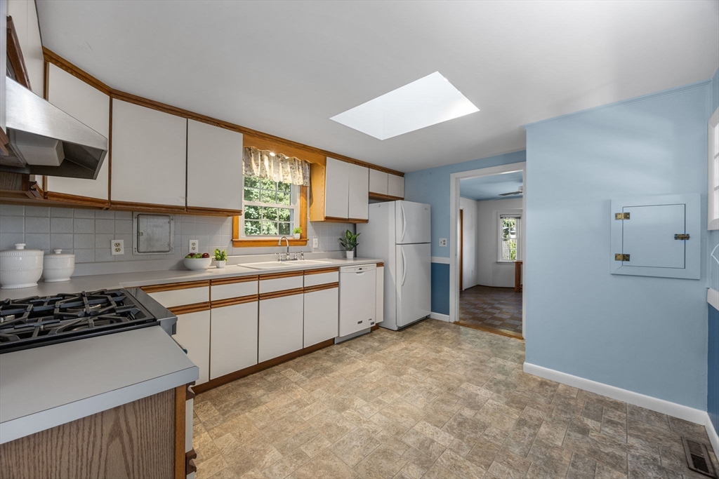 12 Spoonbill Road Dennis, MA 02670 - Photo 9 of 26 a kitchen with refrigerator and cabinets