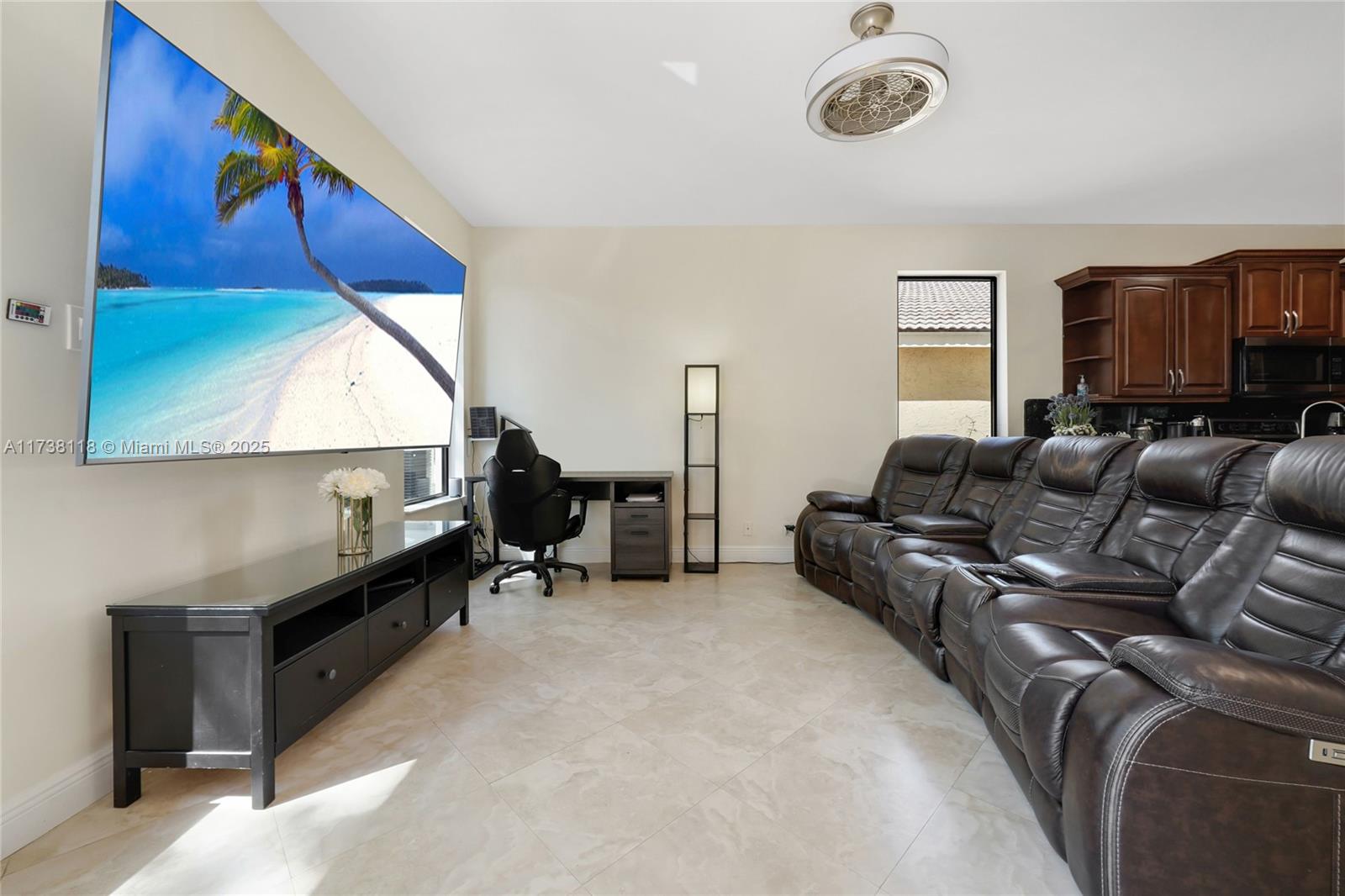 Silver Shores Miramar, FL 33027 - Photo 11 of 42 a living room with furniture and a window