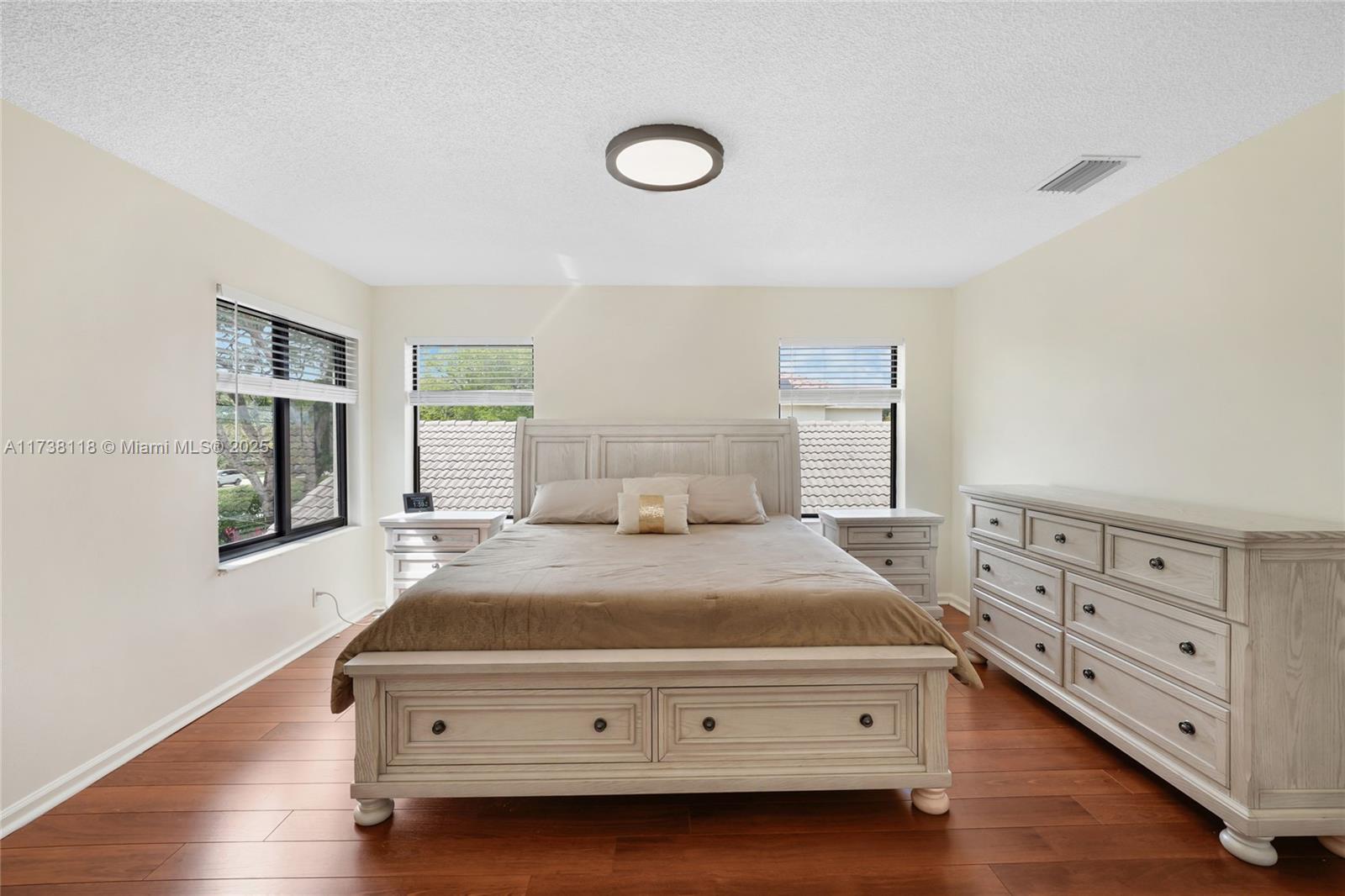 Silver Shores Miramar, FL 33027 - Photo 19 of 42 a bedroom with a bed and a dresser