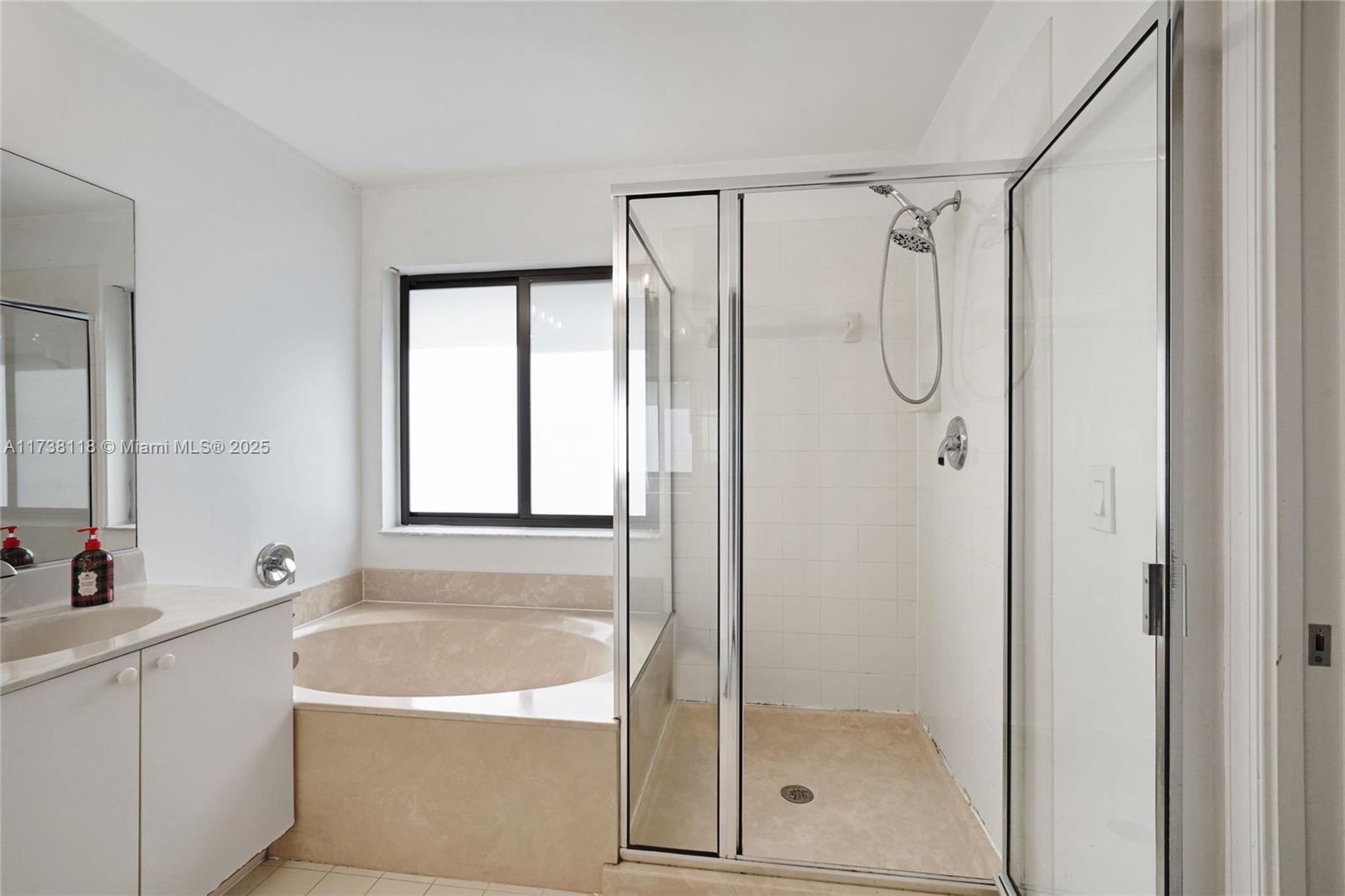 Silver Shores Miramar, FL 33027 - Photo 22 of 42 a bathroom with a shower a mirror and a shower