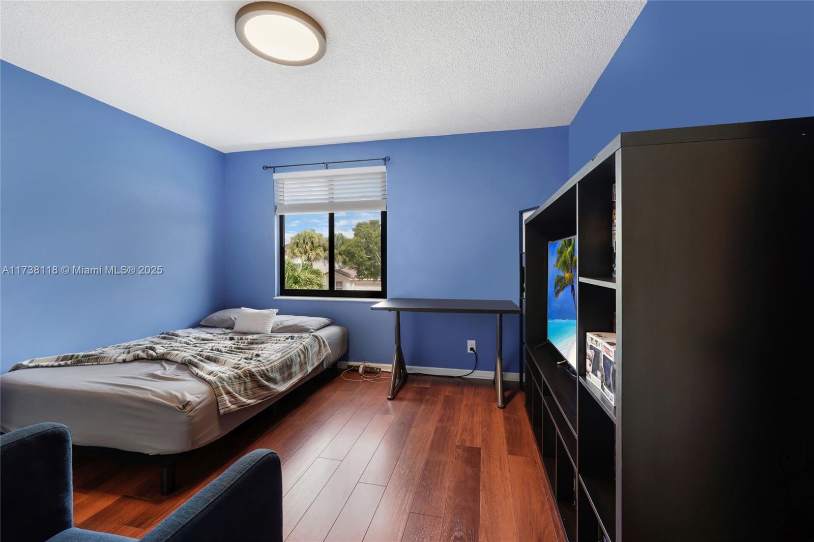 Silver Shores Miramar, FL 33027 - Photo 24 of 42 a bedroom with a bed and a window