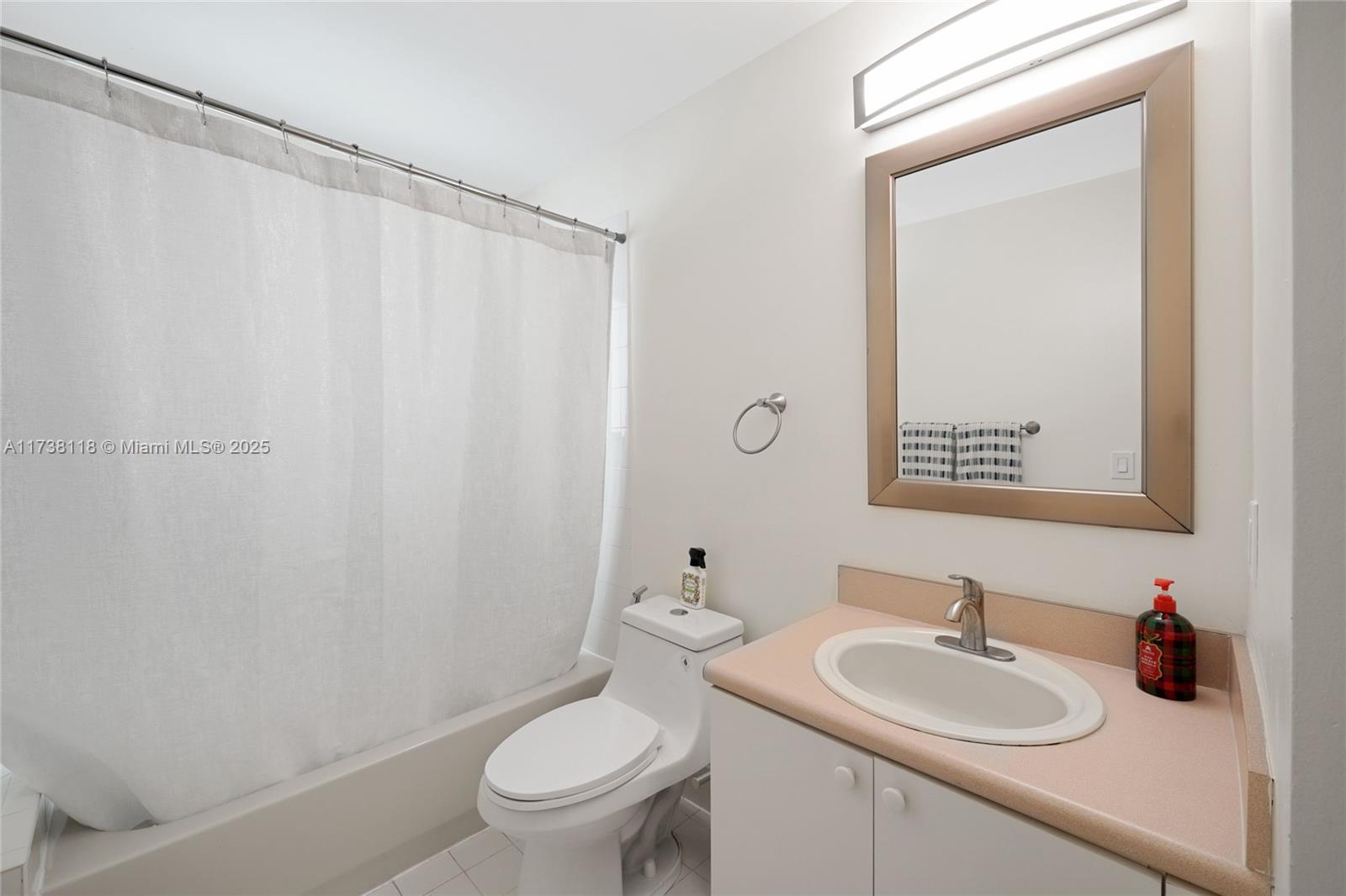 Silver Shores Miramar, FL 33027 - Photo 26 of 42 a bathroom with a sink a toilet and a mirror