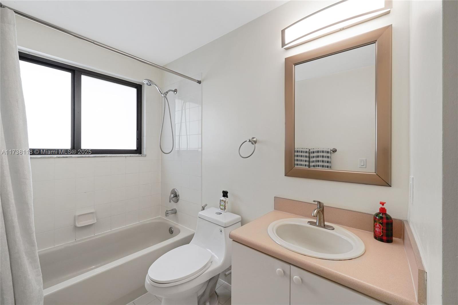 Silver Shores Miramar, FL 33027 - Photo 27 of 42 a bathroom with a sink toilet and shower