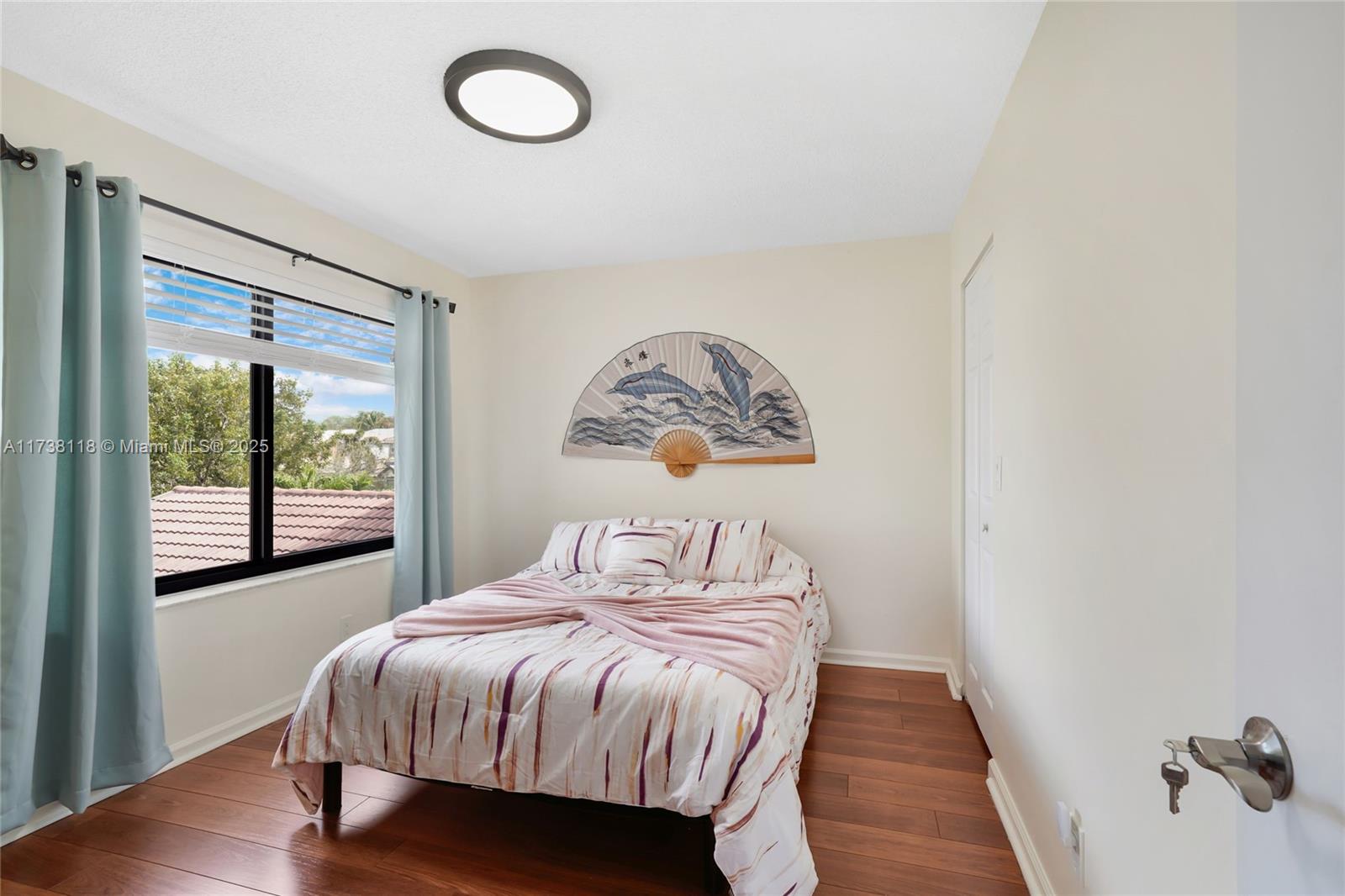 Silver Shores Miramar, FL 33027 - Photo 29 of 42 a bedroom with a bed and window