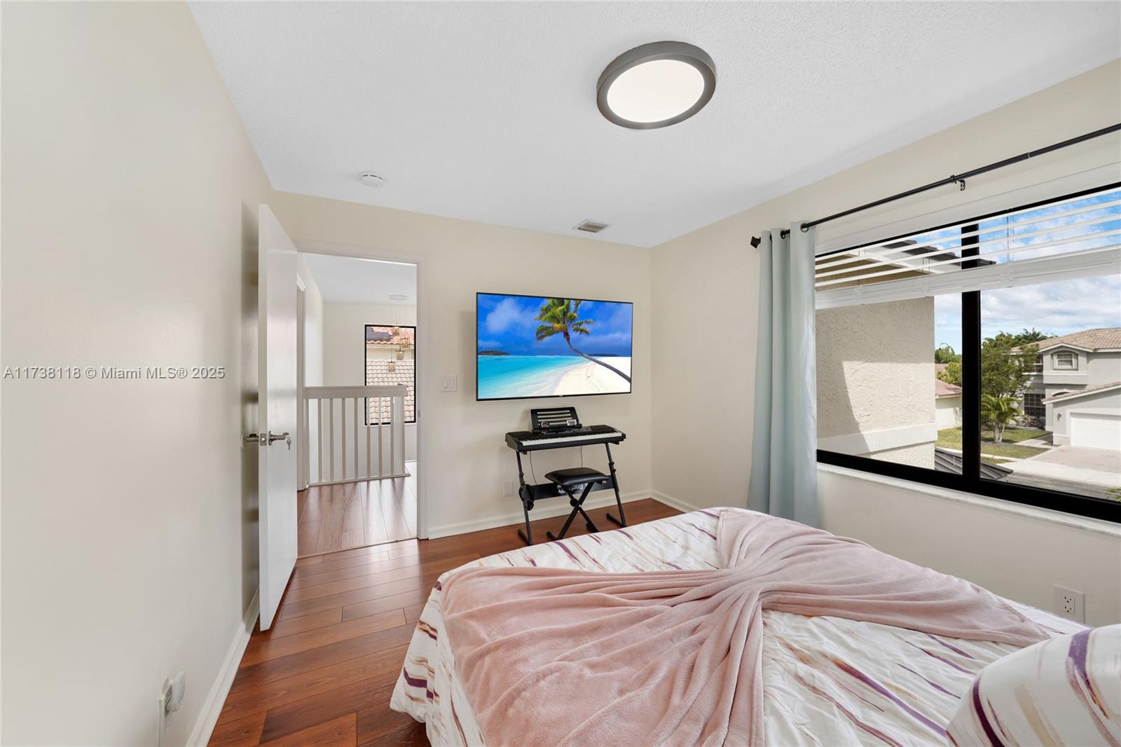 Silver Shores Miramar, FL 33027 - Photo 30 of 42 a bedroom with a bed and a large mirror