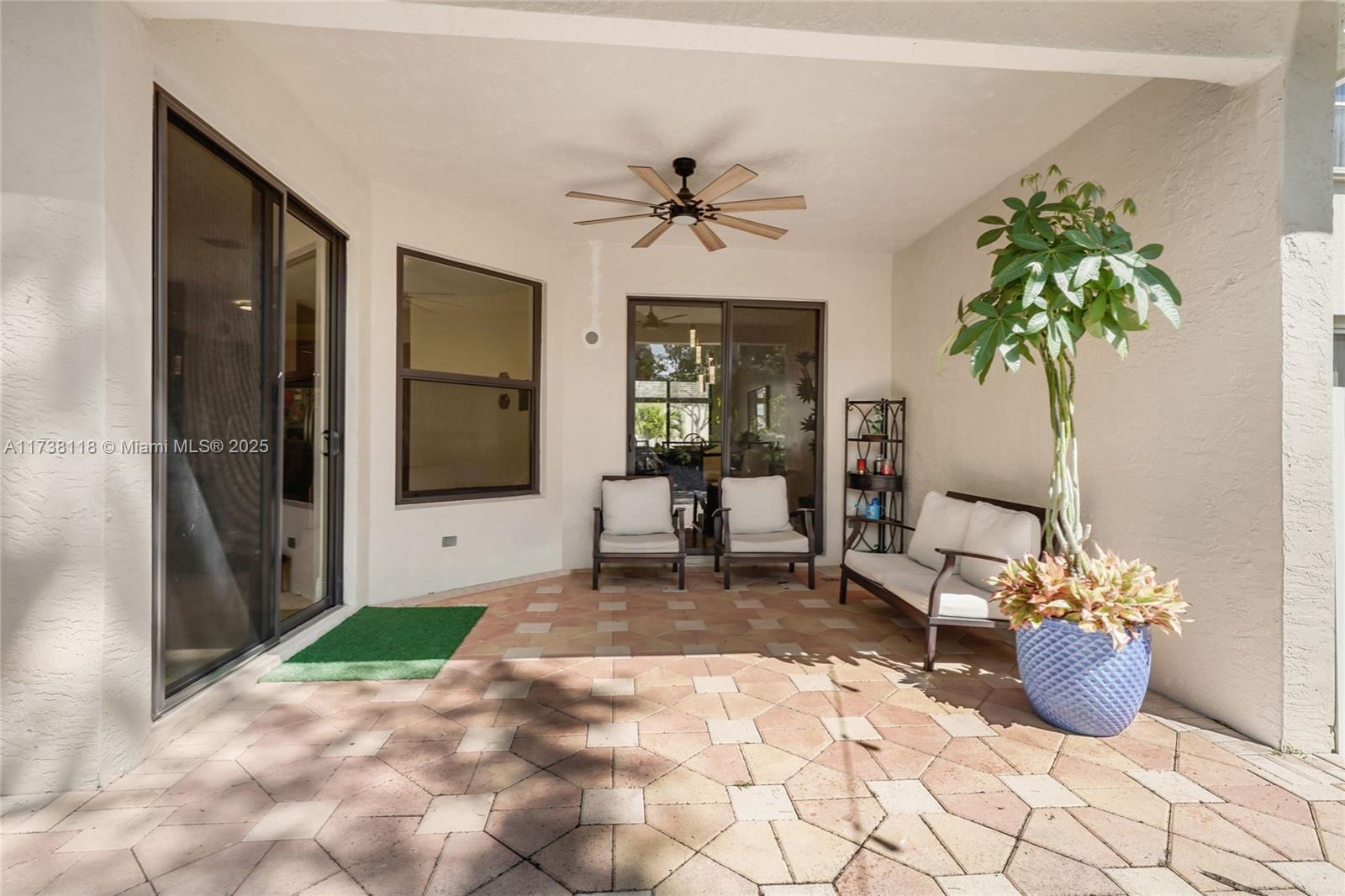 Silver Shores Miramar, FL 33027 - Photo 31 of 42 a living room with furniture and a potted plant