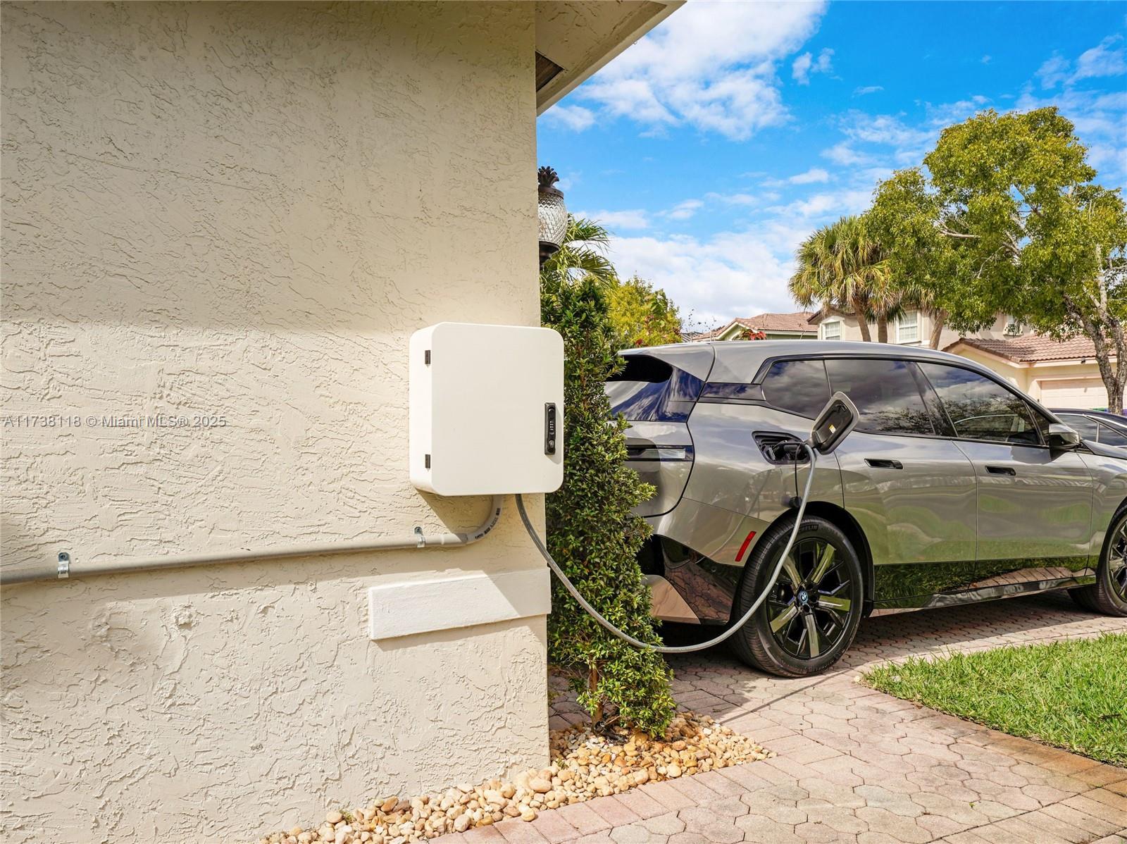 Silver Shores Miramar, FL 33027 - Photo 4 of 42 a view of a backyard with a car parked