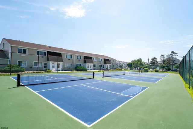 a view of an outdoor space and tennis court