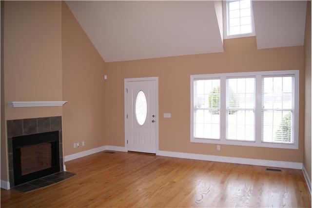 4808 Somerville Road Cross Plains, TN 37049 - Photo 6 of 18 a view of an empty room with wooden floor and a window