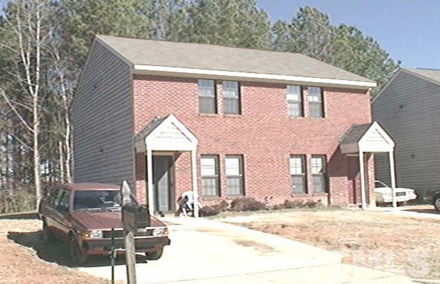 2709 Big Oak Street Raleigh, NC 27610 - Photo 2 of 12 a view of a white house with large windows