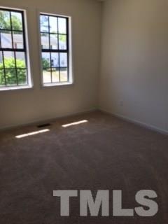 2709 Big Oak Street Raleigh, NC 27610 - Photo 11 of 12 an empty room with a window