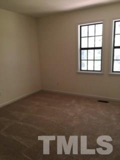 2709 Big Oak Street Raleigh, NC 27610 - Photo 8 of 12 an empty room with a chair