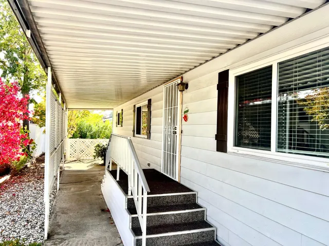 a view of a swimming pool with a patio