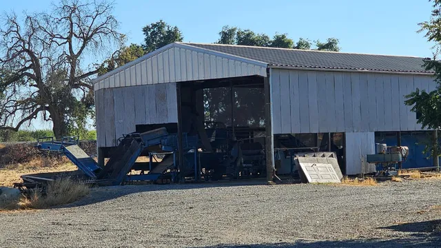 a front view of a house with barbeque grill
