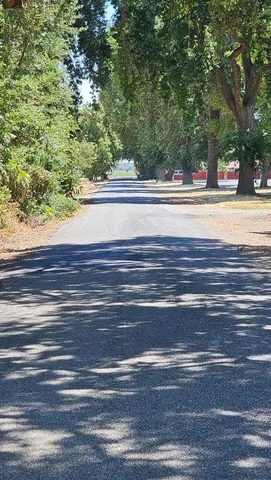 a view of a living room and a floor to ceiling window and a building