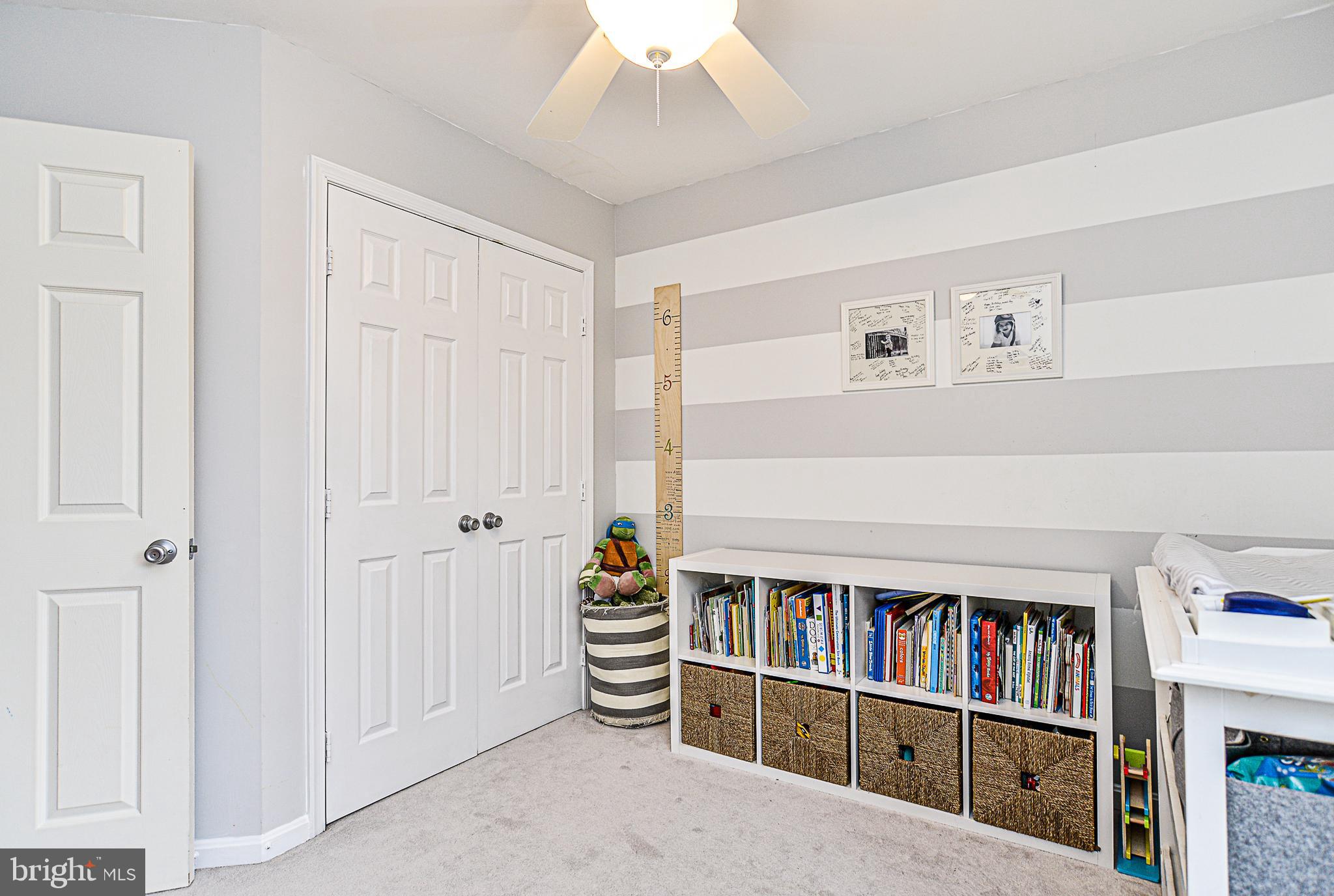 1206 Weatherstone Court Reston, VA 20194 - Photo 22 of 43 a living room with lots of books